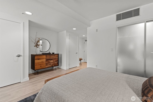 17 W Mercer St Unit 216, Seattle, WA 98119 - bedroom featuring wood finished floors, recessed lighting, a closet, and baseboards