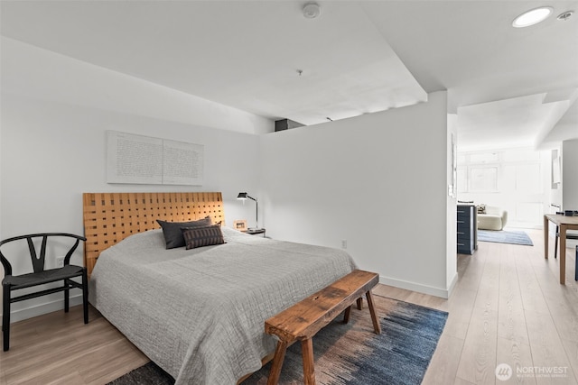 17 W Mercer St Unit 216, Seattle, WA 98119 - bedroom with light wood-style floors, baseboards, and recessed lighting