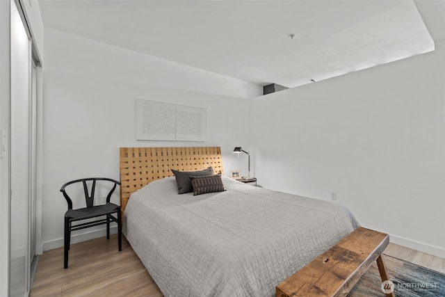 17 W Mercer St Unit 216, Seattle, WA 98119 - bedroom with wood finished floors and baseboards