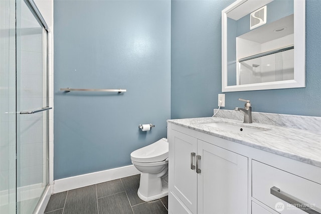 1501 Tacoma Ave S Unit 404, Tacoma, WA 98402 - full bathroom with toilet, vanity, a shower stall, and baseboards
