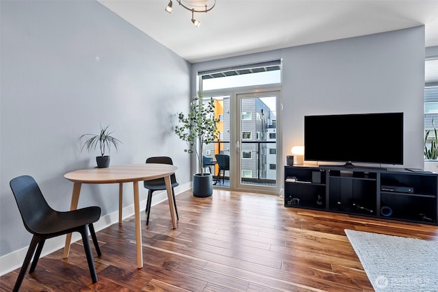 1501 Tacoma Ave S Unit 404, Tacoma, WA 98402 - dining area featuring wood finished floors and baseboards