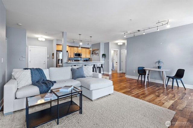 1501 Tacoma Ave S Unit 404, Tacoma, WA 98402 - living room with track lighting, wood finished floors, and baseboards