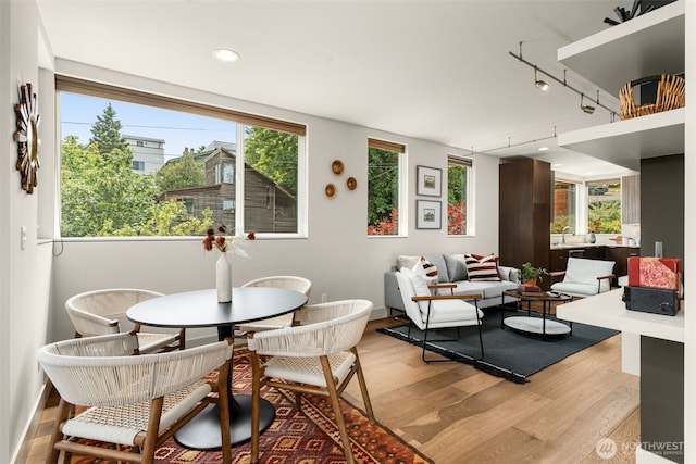 402 W Fulton St, Seattle, WA 98119 - dining area featuring light wood finished floors, rail lighting, and recessed lighting
