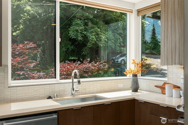402 W Fulton St, Seattle, WA 98119 - kitchen with stainless steel dishwasher, tasteful backsplash, light countertops, and modern cabinets