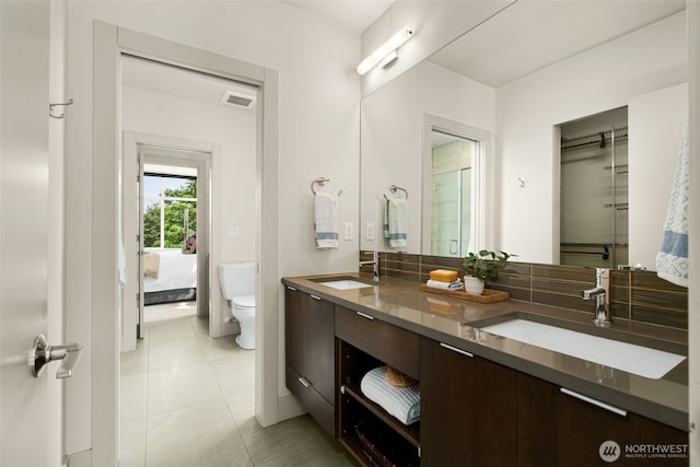 402 W Fulton St, Seattle, WA 98119 - bathroom with double vanity, tile patterned flooring, and connected bathroom