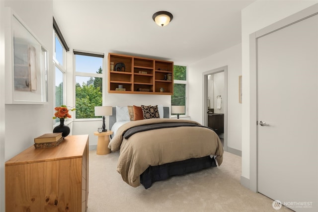 402 W Fulton St, Seattle, WA 98119 - bedroom featuring light colored carpet and ensuite bath