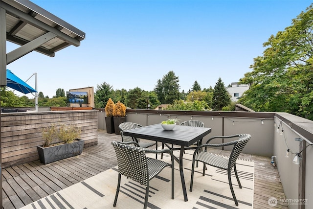 402 W Fulton St, Seattle, WA 98119 - wooden deck with outdoor dining space