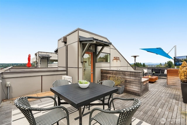 402 W Fulton St, Seattle, WA 98119 - wooden deck with outdoor dining space