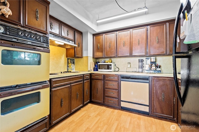 354 Farallone Ave, Fircrest, WA 98466 - kitchen featuring white appliances, light countertops, light wood-style flooring, and decorative backsplash