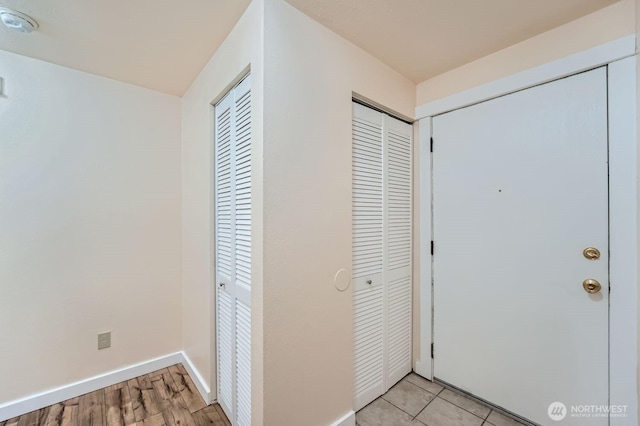 4601 SW 320th St Unit K4, Federal Way, WA 98023 - foyer entrance featuring baseboards and light wood finished floors