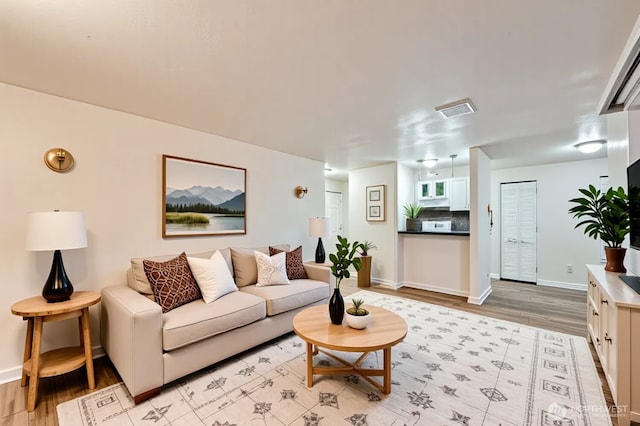 4601 SW 320th St Unit K4, Federal Way, WA 98023 - living room featuring light wood-style flooring and baseboards