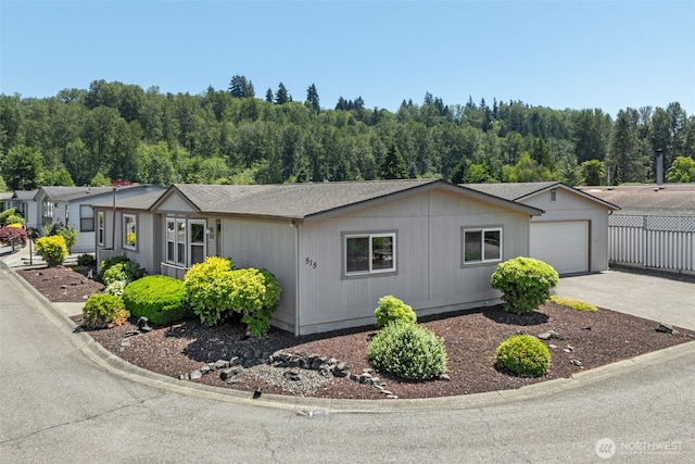 1402 22nd St NE Unit 515, Auburn, WA 98002 - view of front of home with driveway and an attached garage