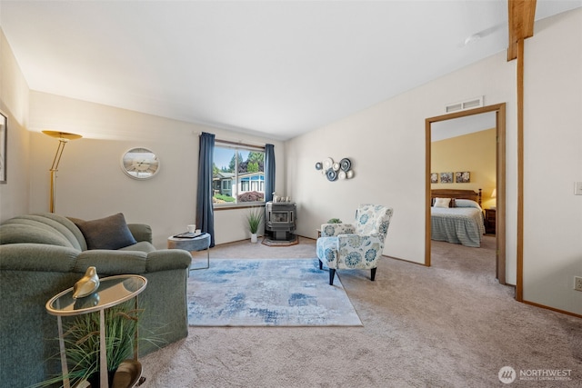 1402 22nd St NE Unit 515, Auburn, WA 98002 - living room with a wood stove and carpet floors