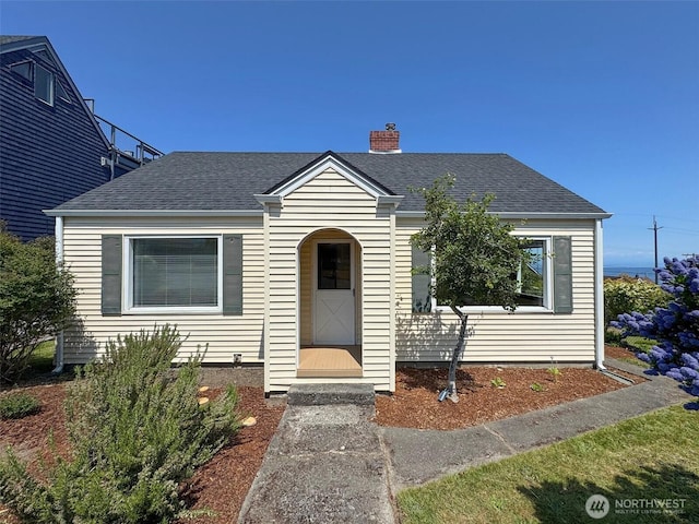1025 W 6th St, Port Angeles, WA 98363 - bungalow-style house featuring roof with shingles and a chimney