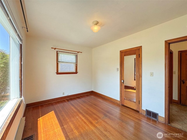 1025 W 6th St, Port Angeles, WA 98363 - spare room with wood finished floors and baseboards