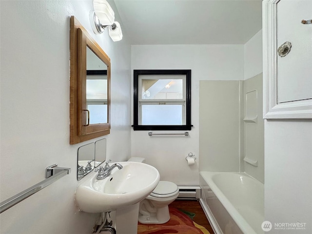 1025 W 6th St, Port Angeles, WA 98363 - full bath with toilet, a baseboard radiator, wood finished floors, and baseboards