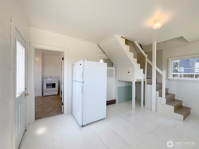 1025 W 6th St, Port Angeles, WA 98363 - kitchen with white appliances and wood finished floors