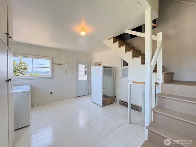 1025 W 6th St, Port Angeles, WA 98363 - staircase with washer / dryer and wood finished floors
