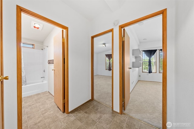 1402 22nd St NE Unit 438, Auburn, WA 98002 - hall featuring carpet flooring and tile patterned floors