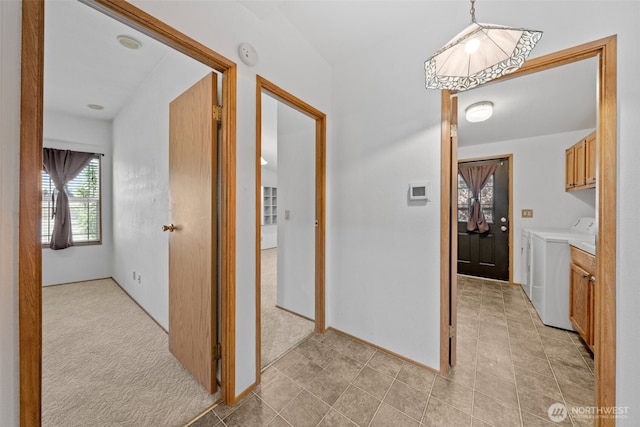 1402 22nd St NE Unit 438, Auburn, WA 98002 - hallway with independent washer and dryer, light colored carpet, and light tile patterned floors