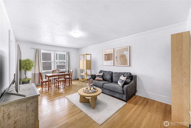 4725 15th Ave NE Unit 37, Seattle, WA 98105 - living area featuring light wood-style flooring, baseboards, and ornamental molding