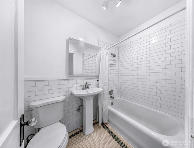 4725 15th Ave NE Unit 37, Seattle, WA 98105 - bathroom with toilet, shower / bath combination with curtain, tile patterned flooring, tile walls, and wainscoting