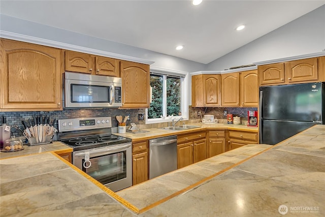 32116 Sunny Ln, Black Diamond, WA 98010 - kitchen featuring stainless steel appliances, a sink, lofted ceiling, decorative backsplash, and tile countertops