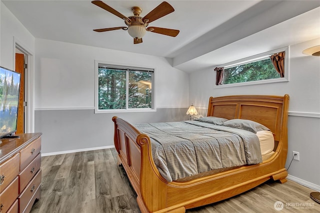 32116 Sunny Ln, Black Diamond, WA 98010 - bedroom with wood finished floors, ceiling fan, and baseboards