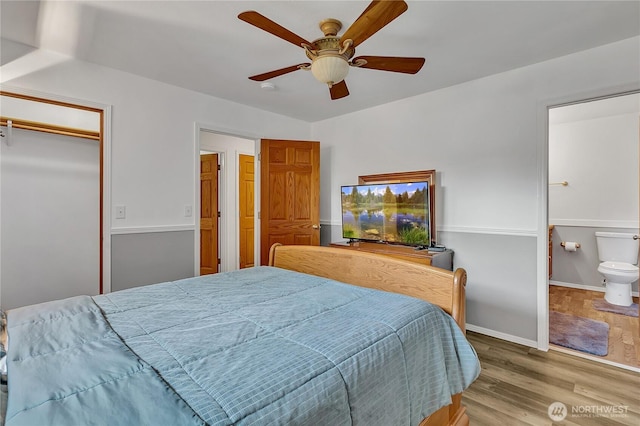 32116 Sunny Ln, Black Diamond, WA 98010 - bedroom with wood finished floors, ensuite bathroom, a ceiling fan, baseboards, and a closet