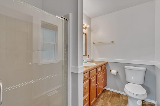 32116 Sunny Ln, Black Diamond, WA 98010 - full bathroom featuring a shower stall, vanity, toilet, wood finished floors, and baseboards