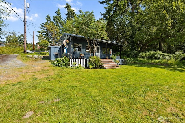 18482 Pull And Be Damned Rd, La Conner, WA 98257 - view of green lawn with a porch