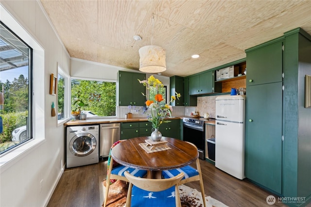 18482 Pull And Be Damned Rd, La Conner, WA 98257 - kitchen with green cabinets, appliances with stainless steel finishes, washer / dryer, dark wood-style floors, and recessed lighting