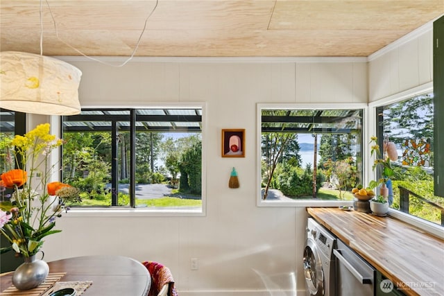 18482 Pull And Be Damned Rd, La Conner, WA 98257 - sunroom / solarium featuring washer / clothes dryer and plenty of natural light