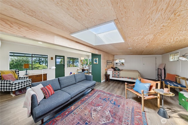 18482 Pull And Be Damned Rd, La Conner, WA 98257 - living area featuring a skylight, wood finished floors, and wood ceiling
