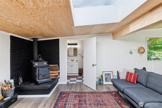 18482 Pull And Be Damned Rd, La Conner, WA 98257 - living room featuring wood finished floors and a wood stove