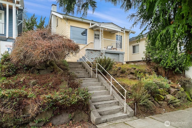 5011 5th Ave NE, Seattle, WA 98105 - view of front of house featuring stairway and a chimney