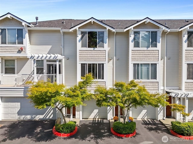 11864 NE 162nd Ln Unit 11-2, Bothell, WA 98011 - view of property with a garage and driveway