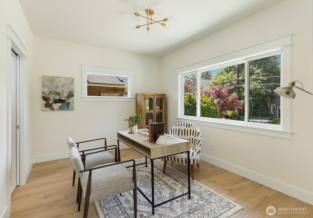 3304 37th Ave S, Seattle, WA 98144 - home office with plenty of natural light, light wood-type flooring, baseboards, and a chandelier