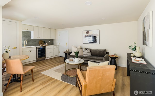 3304 37th Ave S, Seattle, WA 98144 - living area featuring beverage cooler and light wood-style flooring