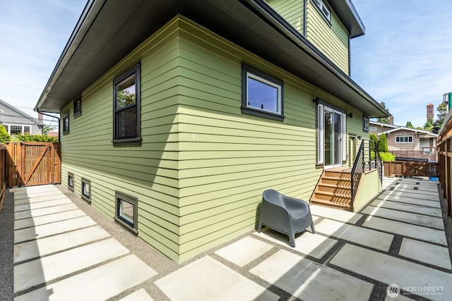 3304 37th Ave S, Seattle, WA 98144 - view of property exterior with a patio and a gate