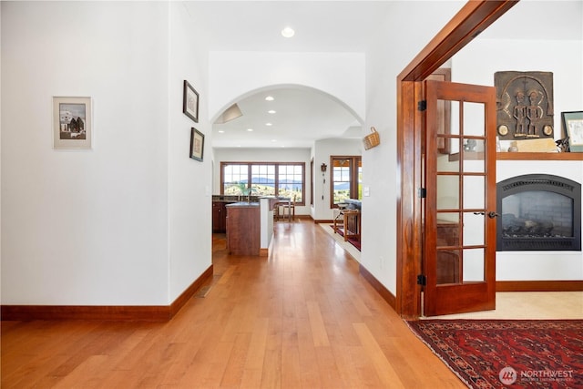 134 Borealis Ln, Manson, WA 98831 - corridor with arched walkways, light wood-style flooring, baseboards, and recessed lighting