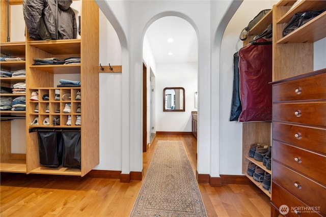 134 Borealis Ln, Manson, WA 98831 - walk in closet with arched walkways and wood finished floors