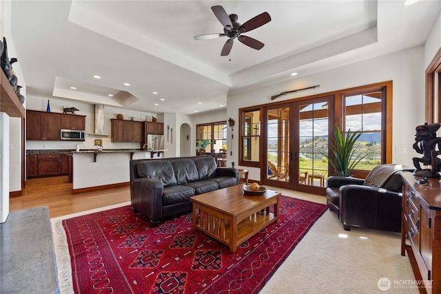 134 Borealis Ln, Manson, WA 98831 - living room featuring a raised ceiling, recessed lighting, healthy amount of natural light, and a ceiling fan