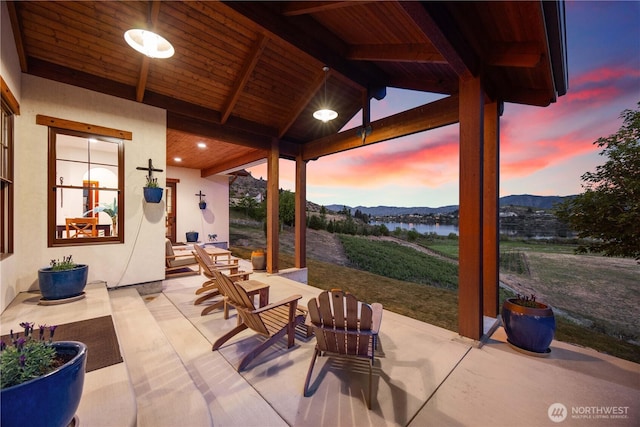 134 Borealis Ln, Manson, WA 98831 - view of patio with a water and mountain view