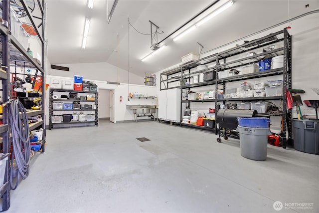 134 Borealis Ln, Manson, WA 98831 - garage with a workshop area and a garage door opener