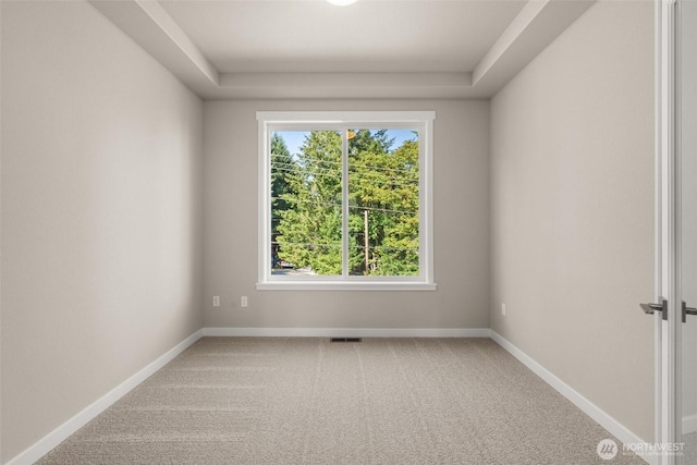 9645 7th Ave SE, Lacey, WA 98513 - carpeted spare room with a raised ceiling and baseboards