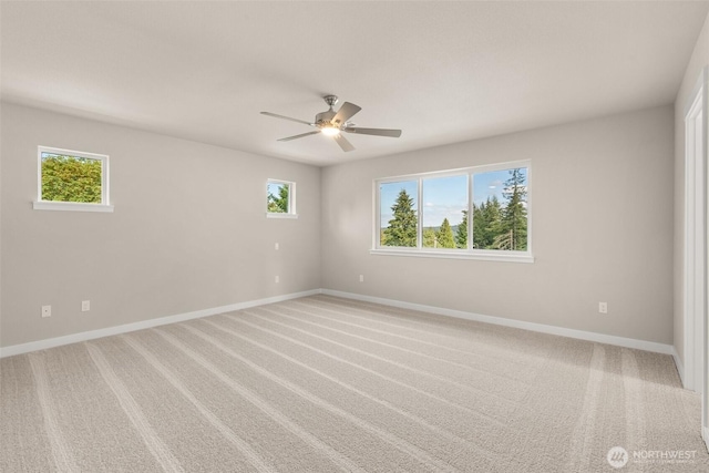 9645 7th Ave SE, Lacey, WA 98513 - unfurnished room featuring plenty of natural light, ceiling fan, and light colored carpet