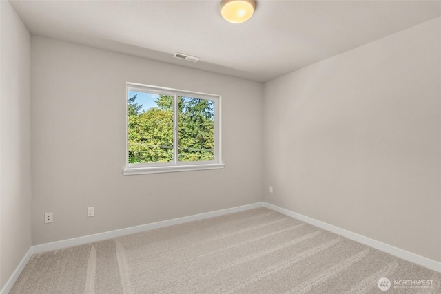 9645 7th Ave SE, Lacey, WA 98513 - carpeted spare room featuring baseboards