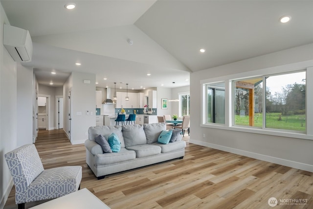 3848 Marine Way, Bellingham, WA 98225 - living area featuring vaulted ceiling, an AC wall unit, light wood-style flooring, recessed lighting, and baseboards