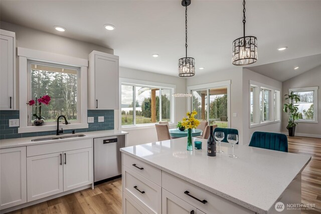 3848 Marine Way, Bellingham, WA 98225 - kitchen featuring stainless steel dishwasher, a sink, healthy amount of natural light, a chandelier, and recessed lighting